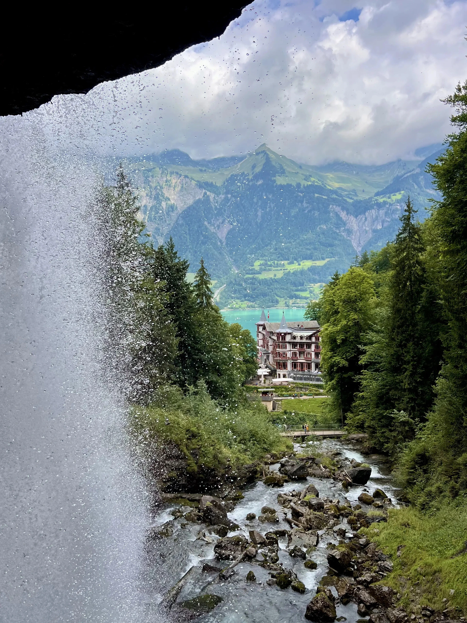 Giessbach waterfalls cascading down multiple tiers with Grandhotel Giessbach visible