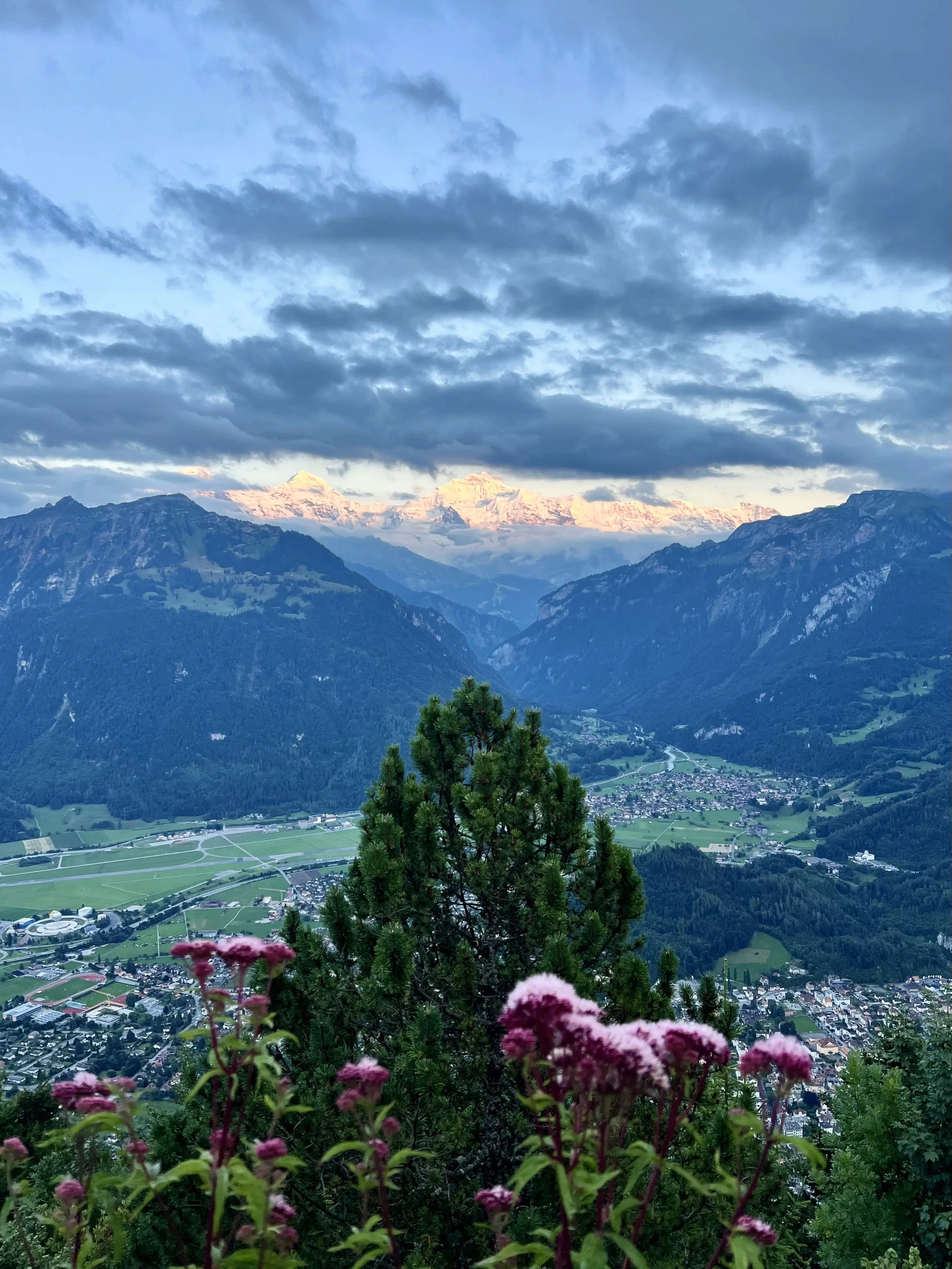 Sunset view from Harder Kulm showing Interlaken, Lake Thun, and surrounding mountains