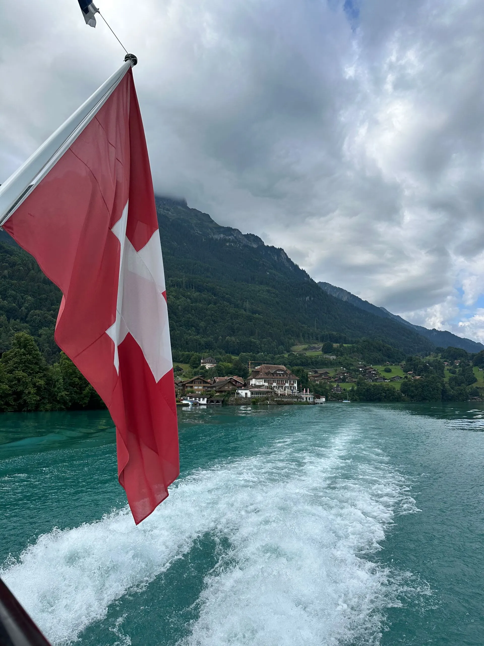 Lake Brienz with mountains and waterfalls in background