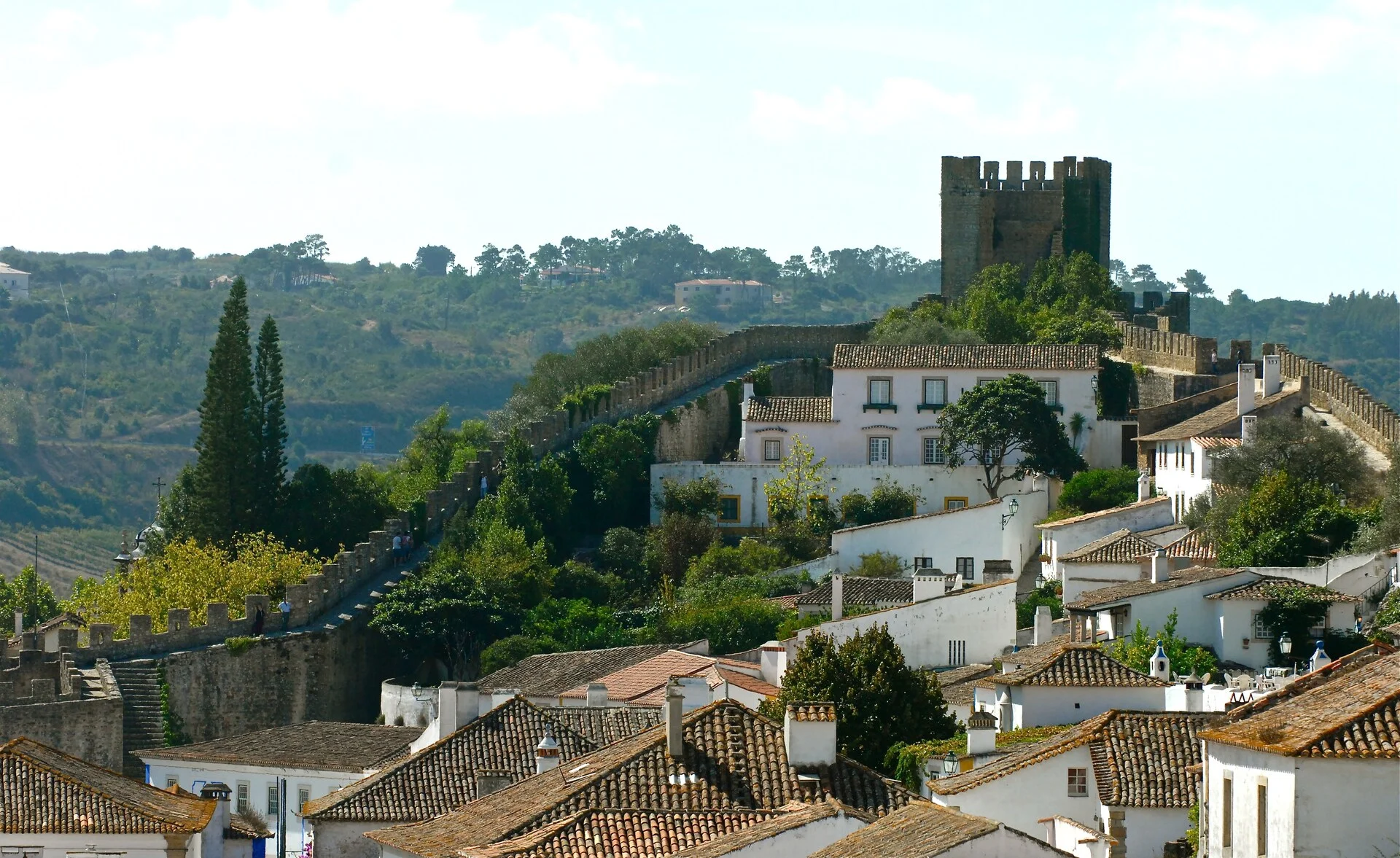 Óbidos medieval walled town in Portugal with whitewashed houses, cobblestone streets, and castle walls