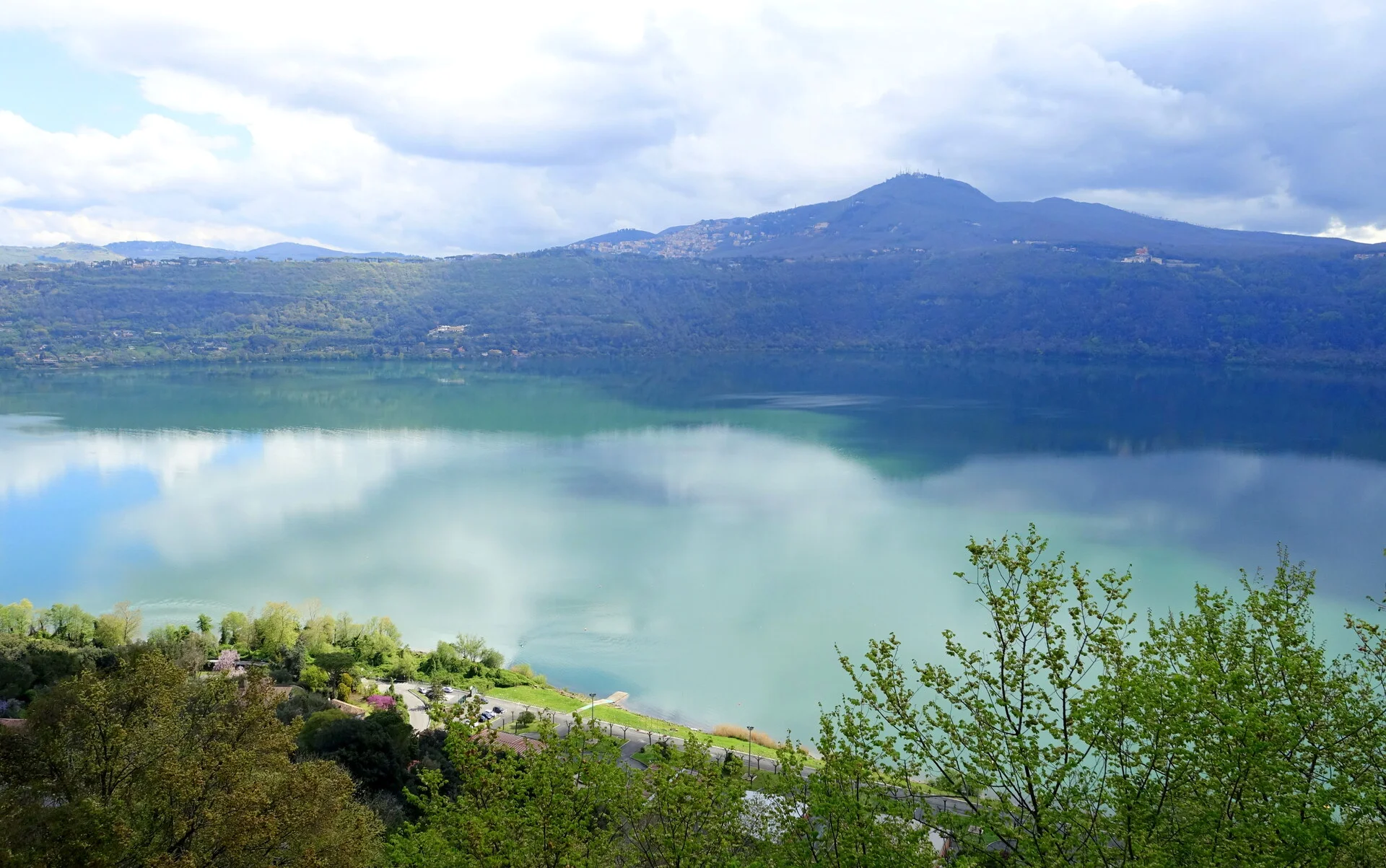 Castel Gandolfo town and Lake Albano viewed from above with the papal palace overlooking the crater lake
