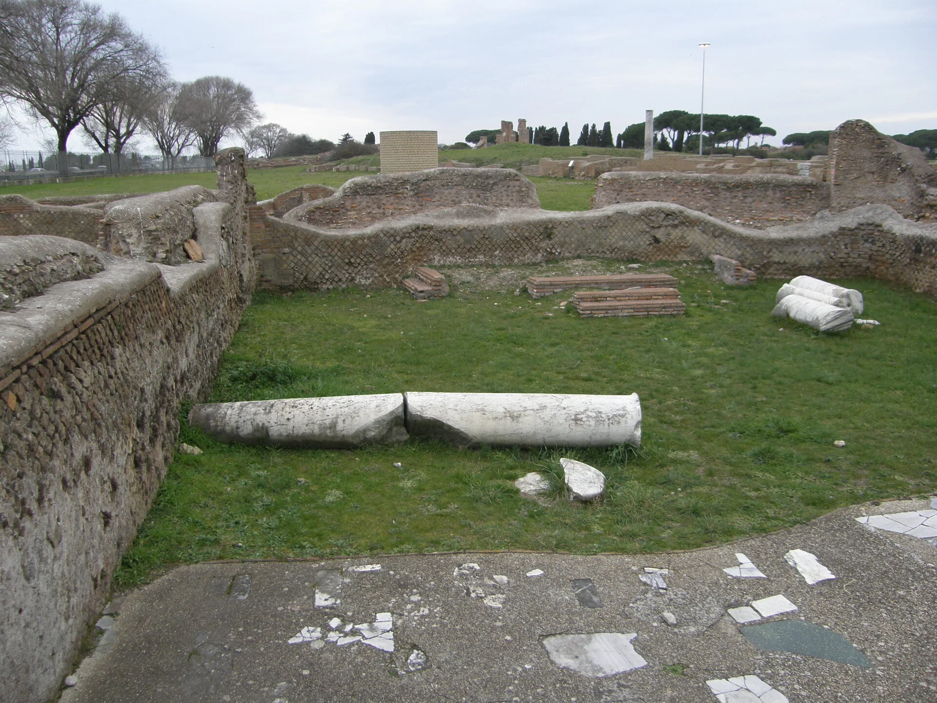 Ostia Antica synagogue interior with ancient Roman mosaic floors and column ruins at Rome's ancient port city