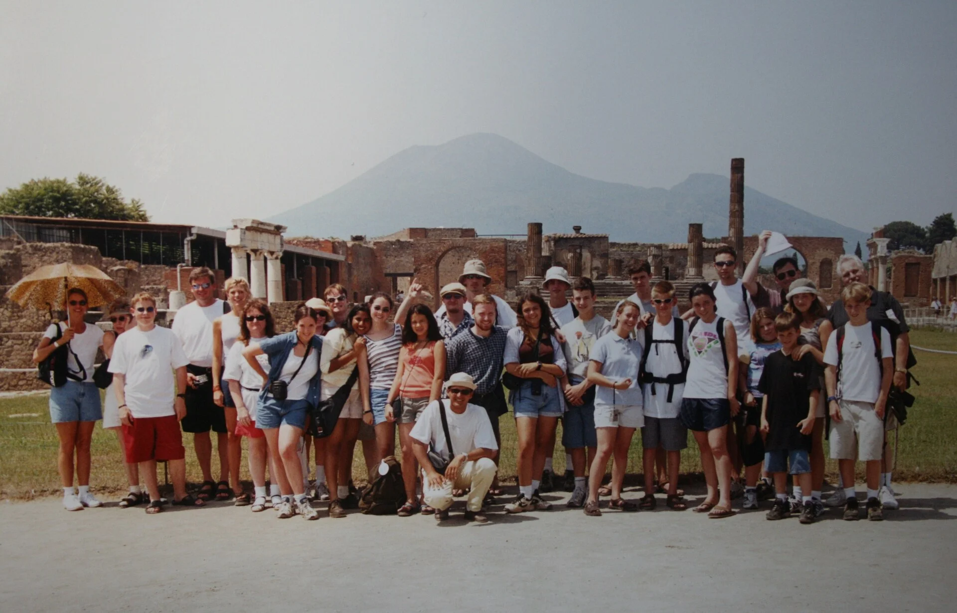 Pompeii archaeological site with the forum and Mount Vesuvius volcano rising in the distance