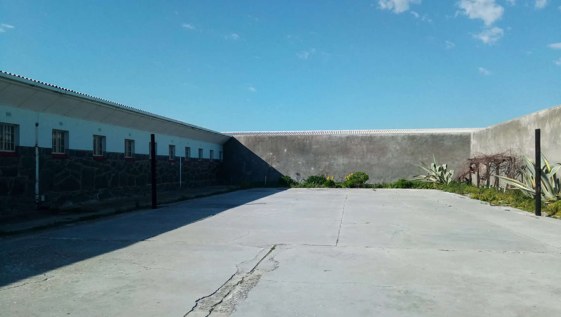 View of Robben Island from the Cape Town waterfront with Table Mountain in the background