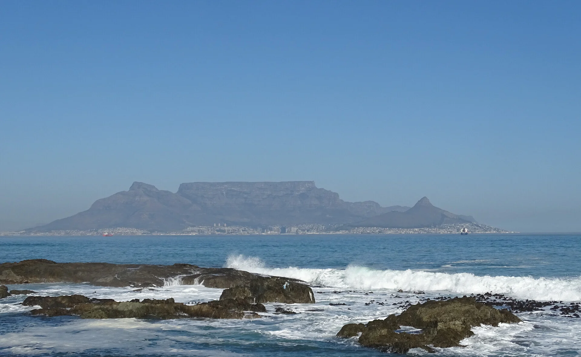 Table Mountain in Cape Town with its iconic flat summit viewed from the city with blue sky
