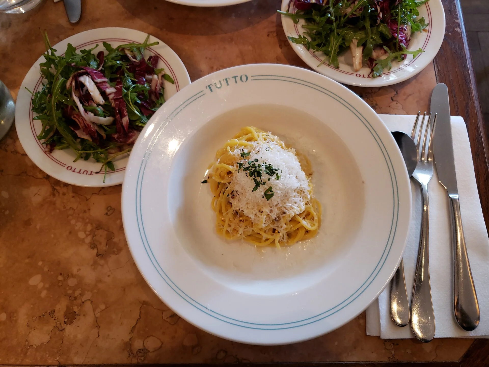 A plate of spaghetti cacio e pepe, a classic Roman pasta dish