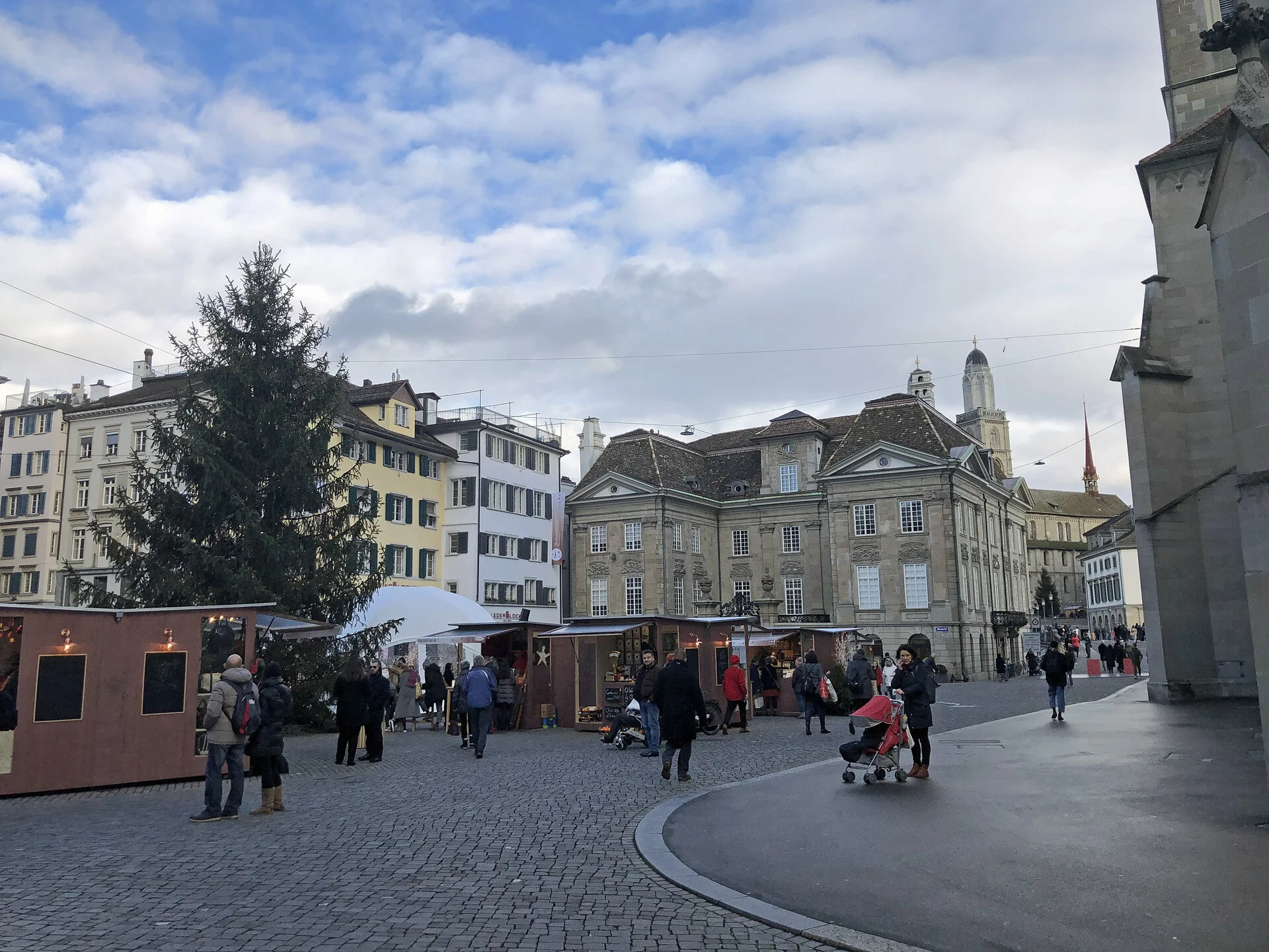 The historic Münsterhof square in Zurich's Old Town filled with market stalls and surrounded by guild houses
