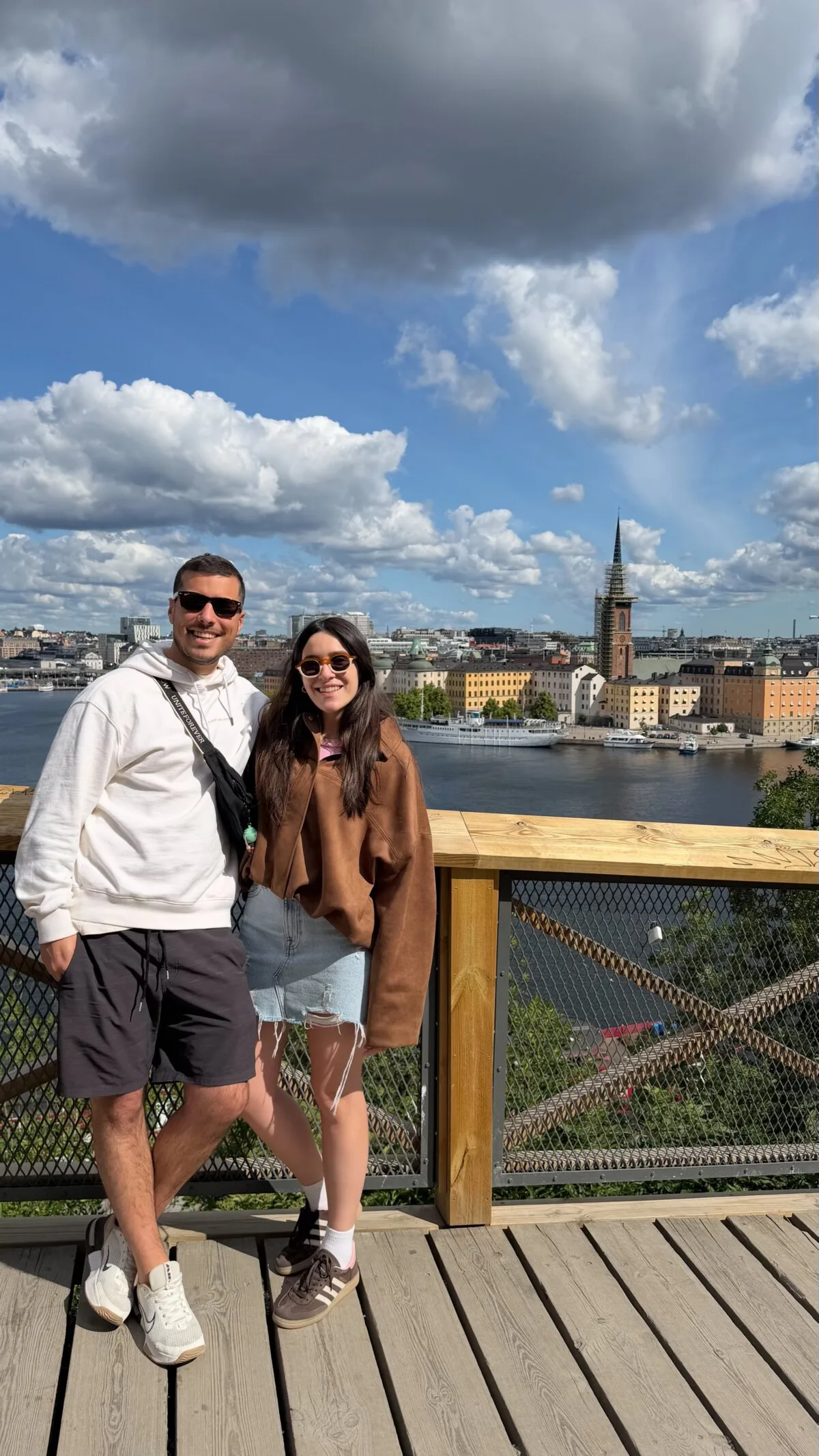 Dem and Vale at the Monteliusvägen viewpoint on Södermalm with Stockholm's islands and church spires behind them