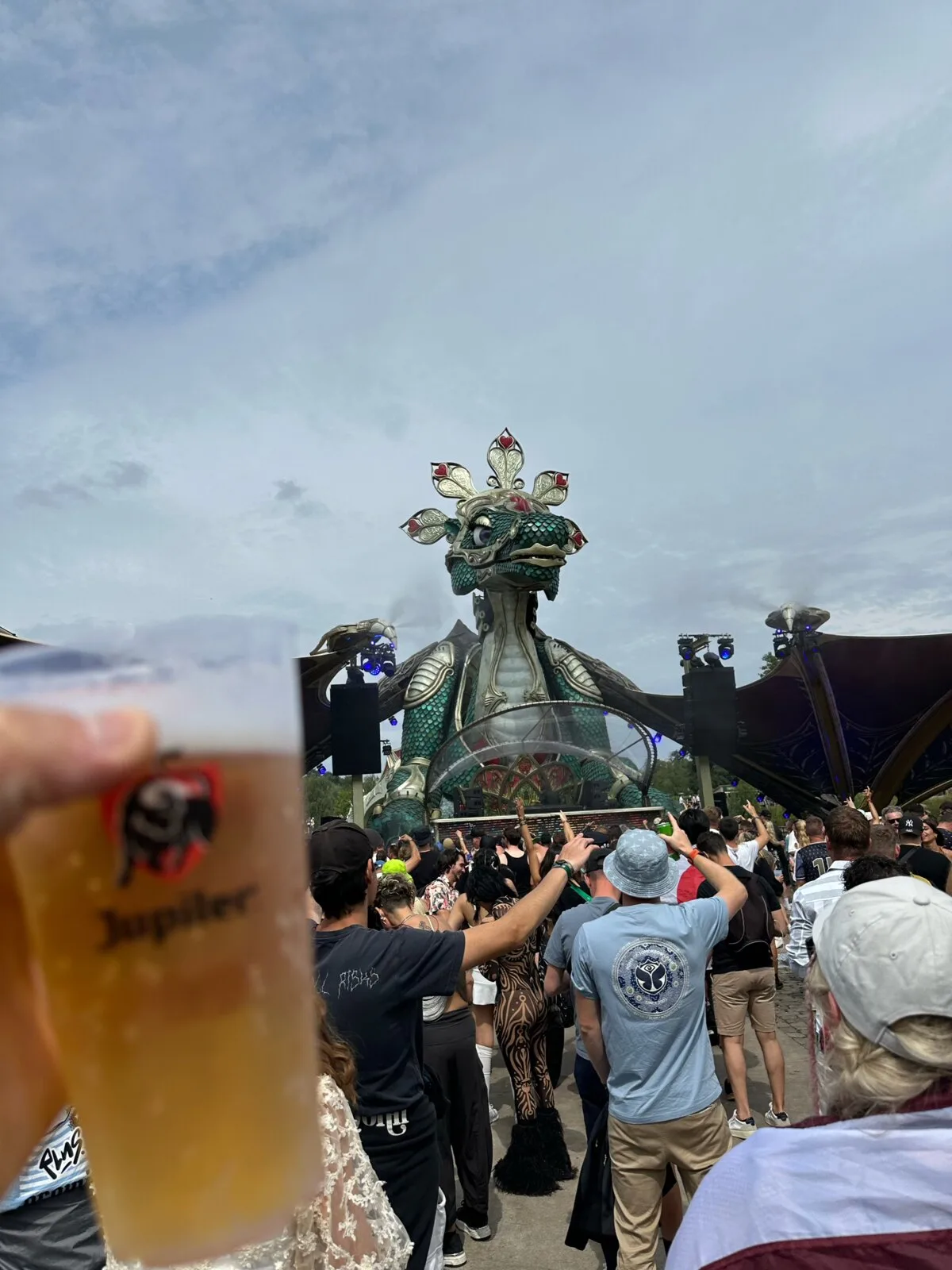 The giant dragon sculpture on the Rose Garden stage at Tomorrowland with a crowd in front