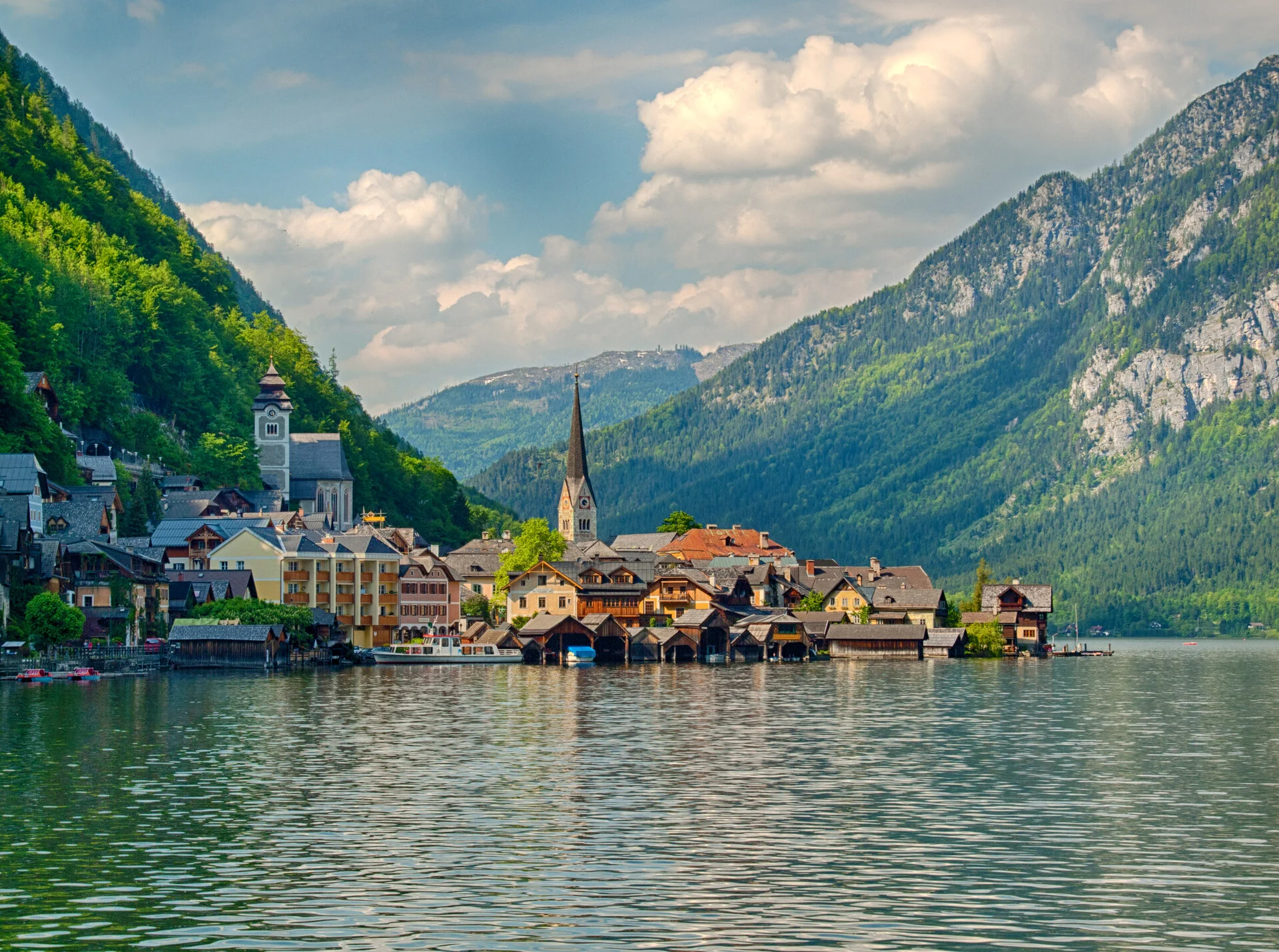 Hallstatt lake village in Austria with pastel houses reflected in the Hallstättersee