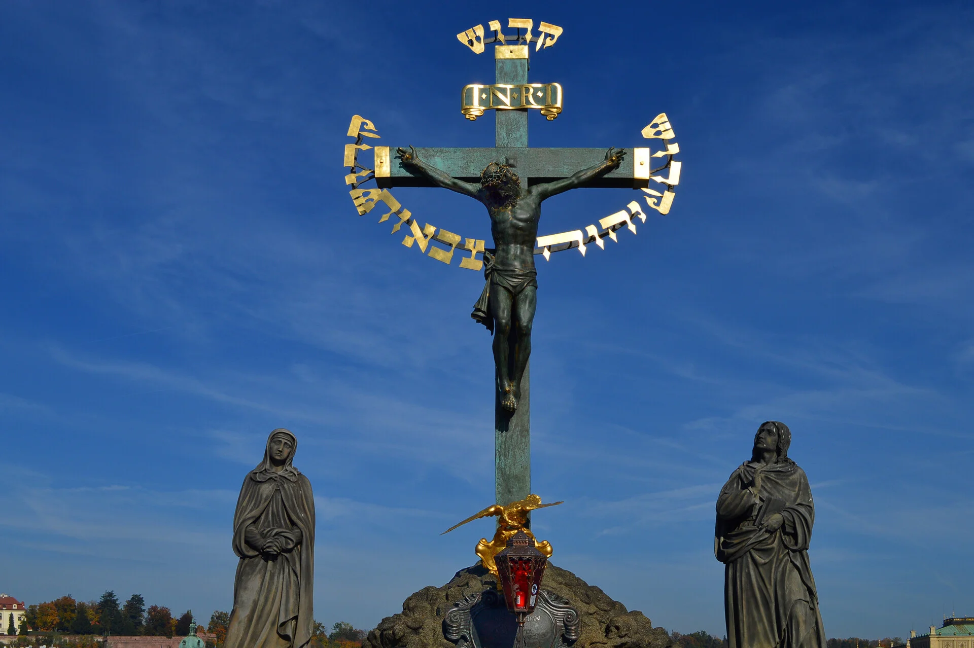 Prague Castle and St. Vitus Cathedral viewed from Charles Bridge with the Vltava River in the foreground
