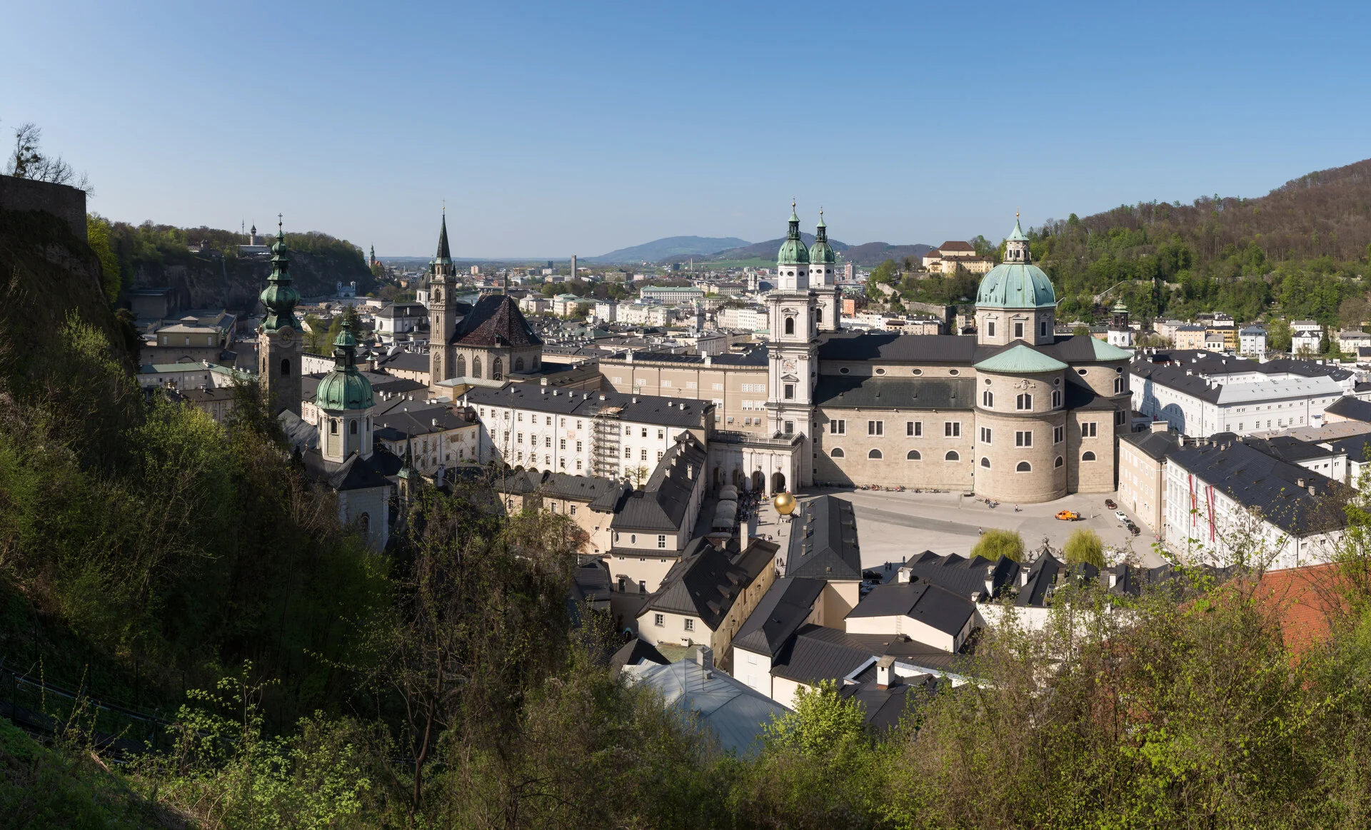 Hohensalzburg Fortress overlooking Salzburg Old Town with the Alps in the background